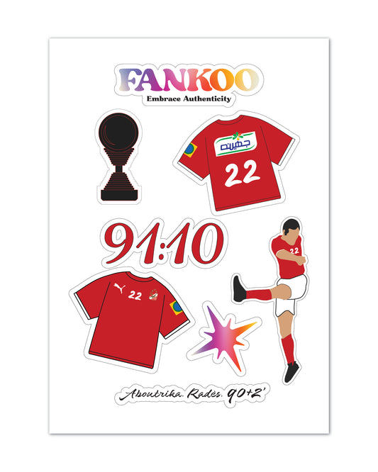 A printed sticker sheet design featuring a soccer theme: the text 'FANKOO Embrace Authenticity' at the top, a trophy icon, two red jerseys with the number 22, large '91:10' score text, a Football player illustration, a starburst graphic, and 'AbouTrika Radws 90+2' at the bottom. The sheet is shown on a plain white background.