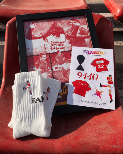 A set of fan merchandise displayed on red stadium seats, including a framed red-and-white sports print, white crew socks with 'FANKOO' printed on them, and a small printed card featuring a red jersey and the brand name FANKOO.