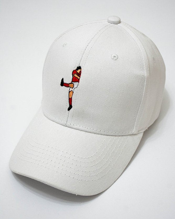 White cap with Aboutrika embroidered design on a white background