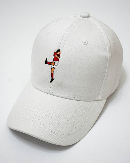 White cap with Aboutrika embroidered design on a white background